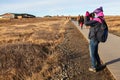 Tourist taking photo of Waterfall Gullfoss, Golden Circle tour,