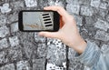 Tourist taking photo of wet cobblestone road Royalty Free Stock Photo