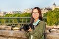 Tourist taking a photograph at bank of Seine