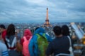 Tourist taking photos of Paris cityscape with Eiffel tower.