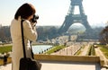 Tourist taking a picture of the Eiffel Tower