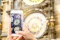 Tourist taking picture of a famous attraction with smartphone. Royalty Free Stock Photo