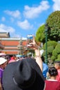 Tourist taking picture of a Giant Statue