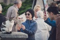 Tourist taking pictures of a cat Royalty Free Stock Photo