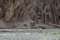 A tourist taking pictures on mountain in Leh, India Royalty Free Stock Photo