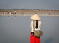 A tourist taking pictures on the salt field in Vietnam
