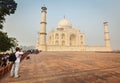 Tourist taking pictures of Taj Mahal - famous Indian landmark a