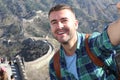 Tourist taking a selfie in the large Great Wall of China Royalty Free Stock Photo