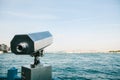 Tourist telescope with scenic view of the sea and blue skies. View of the Bosphorus, Istanbul, Turkey. Royalty Free Stock Photo