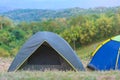 Tourist tent in camp among meadow in the mountain at national park Royalty Free Stock Photo