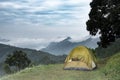 Tourist tent in camp among meadow in the mountain Royalty Free Stock Photo
