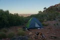 Tourist tent in camp among meadow in the mountain at sunrise with campire, australia Royalty Free Stock Photo