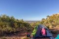 Tourist tent in camp among meadow in the mountain at sunrise with campire, australia Royalty Free Stock Photo