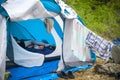 tourist tent camping in forest. Tourist life - clothes are dried, the guitar stands near the ten Royalty Free Stock Photo