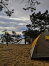 Tourist tent on the lake. Tourist tent on the evening on the lake. Tourist tent in nature.Tourist tent Baikal.