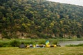 A tourist tent and three catamarans under Ukrainian flag on Dnister riverside, National Nature Park Dnister Canyon, Ukraine