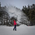 A tourist throwing hot water at winter park