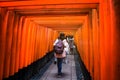 Tourist at Torii gate, Fushimi Inari, Kyoto