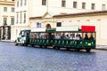 Tourist train on the medieval street of europian city