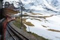 Tourist train to Jungfrau Top of Europe mountain in first day of summer. Travelling in Switzerland in summer Royalty Free Stock Photo