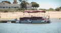 Tourist transport boats moored in the lagoons of the Ria Formosa Natural Park near the port of Tavira, portugal