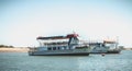 Tourist transport boats moored in the lagoons of the Ria Formosa Natural Park near the port of Tavira, portugal