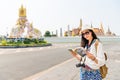 Tourist with travel guide book on grand palace