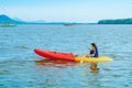 Tourist travel by raft boats to relax and kayaking to watch the red hawks and mangrove forest in the sea  at Bang Chan The No- Royalty Free Stock Photo