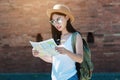 Tourist travel woman looking at the map while walking on a street Royalty Free Stock Photo