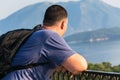 The tourist traveler enjoys the view of the sea and the bay