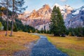 Tourist treck to Oeschinensee Lake. Colorful morning scene of Swiss Alps with Bluemlisalp mountain on background. Splendid autumn