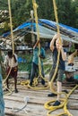 Tourist trying the indian fishermen`s life on in Kochi