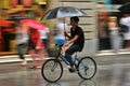 Tourist trying to take shelter against the rain in Florence Italy Royalty Free Stock Photo