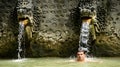 Tourist underneath ornamental Bali water sources