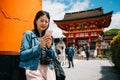 Tourist using cellphone to contact her family Royalty Free Stock Photo