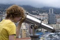 Tourist using coin telescope