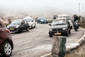 Tourist vehicles lined up to climb in the step hill region of himalayan mountain valley