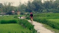 Tourist and guide on rice fields in Sa Pa valley