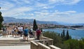 Tourist at viewpoint overlooking Split seafront and ocean. Royalty Free Stock Photo