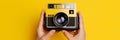 Tourist vintage photograph young style photography black photo lens technology yellow hobby retro old camera Royalty Free Stock Photo