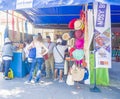 Tourist visit exhibition stand during the Malagasy carnival