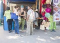 Tourist visit exhibition stand during the Malagasy carnival