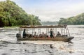 Tourist visit the Murchison Falls on the White Nile river, Ugand