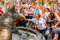 Tourist visit one of the popular monuments in Florence - Fontana del Porcellino, located at Piazza del Mercato Nuovo