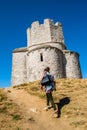 Tourist visit very old catholic church of St. Nicolas in Nin in Croatia near Zadar. Royalty Free Stock Photo