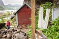 Tourist visiting Helleren houses in Jossingfjord, Norway Royalty Free Stock Photo