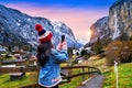 Tourist visiting village of Lauterbrunnen in the Bernese Oberland, Switzerland