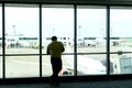 Tourist wait for airplane flight to fly to the point at the terminal