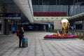 A tourist waits for friends at the Zhuhai Port building