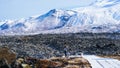 Tourist walk in Iceland volcanic landscape moutnian background